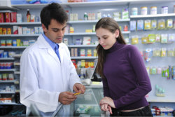 pharmacist with a young girl